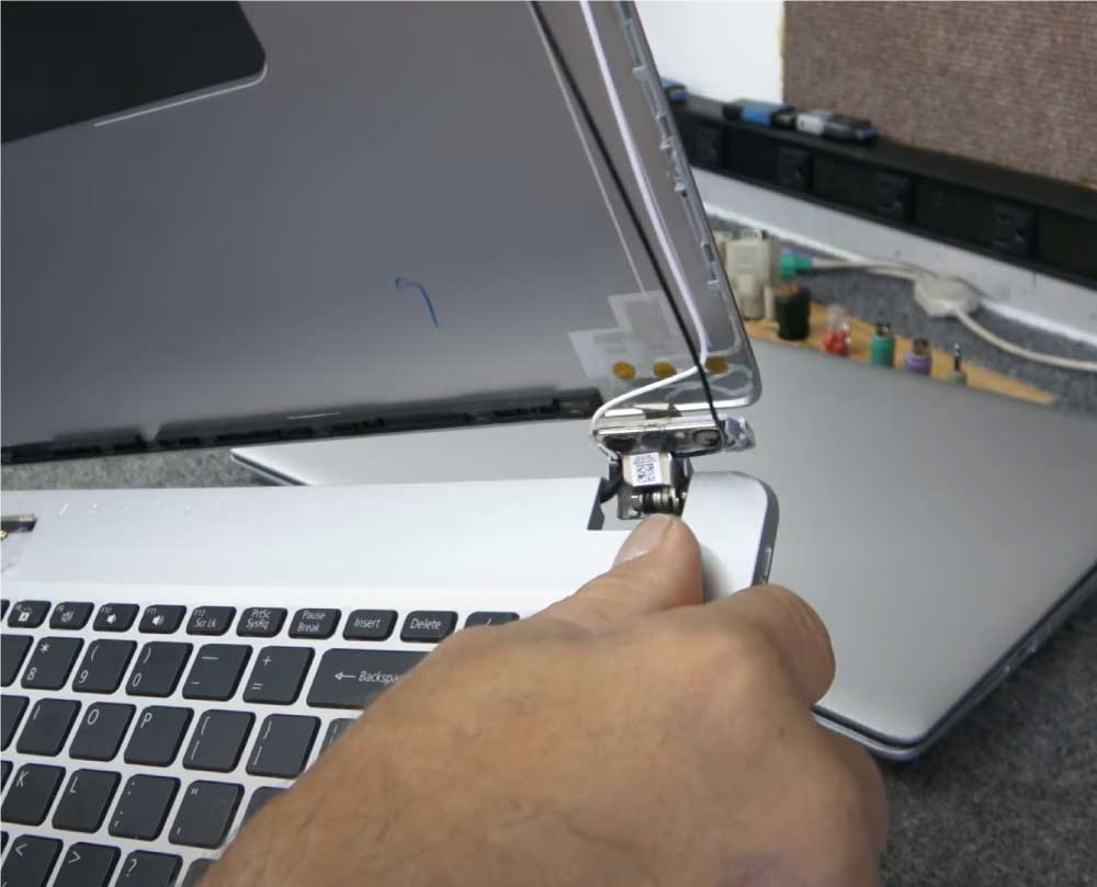 Volta PC technician repairing Acer hinge