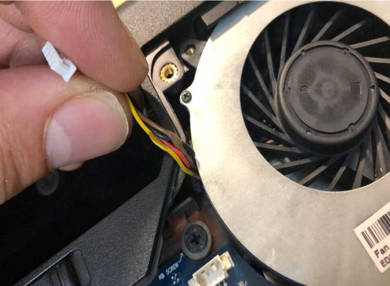 Technician checking fan before replacing