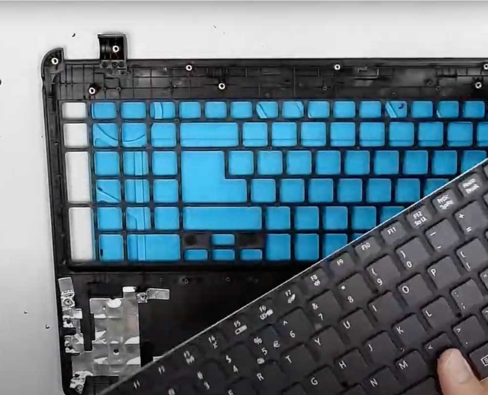 technician replacing Acer laptop keyboard