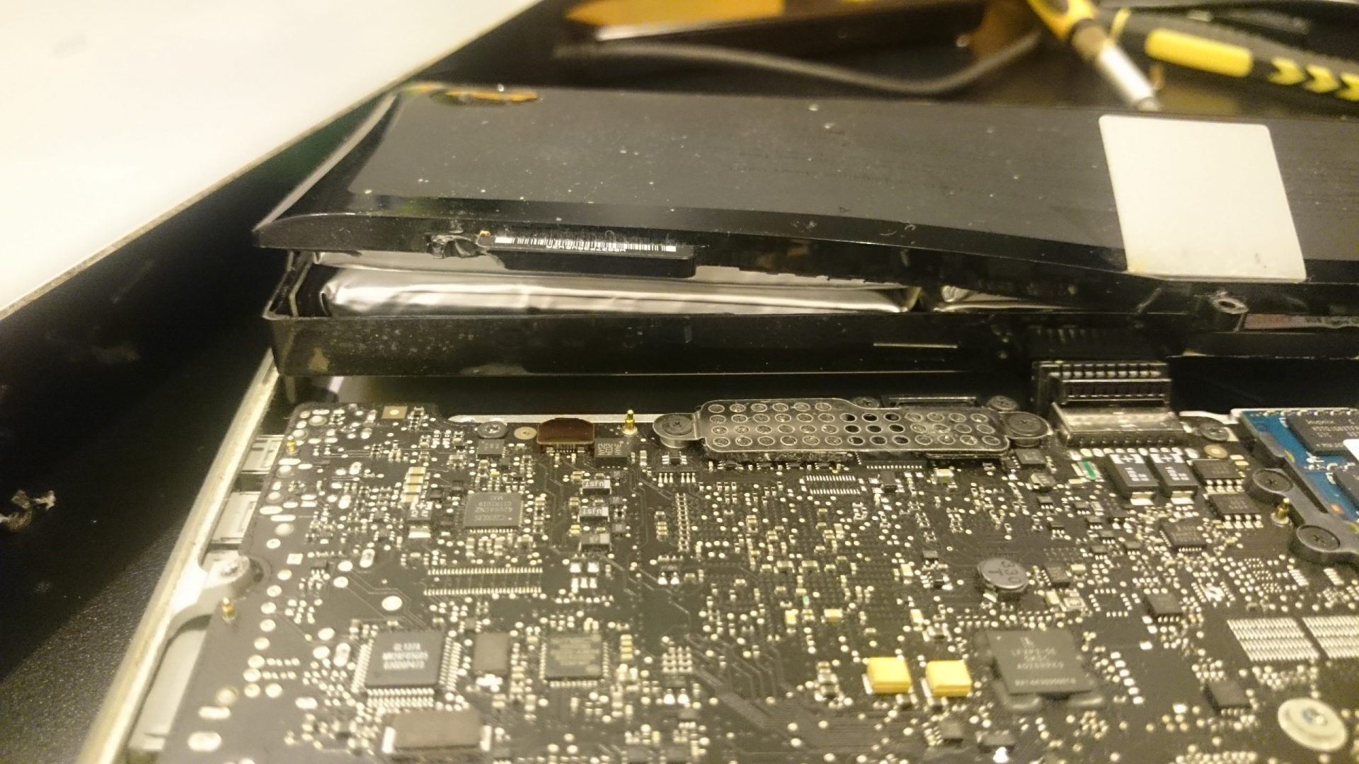 Macbook Pro Bloated Battery Close up