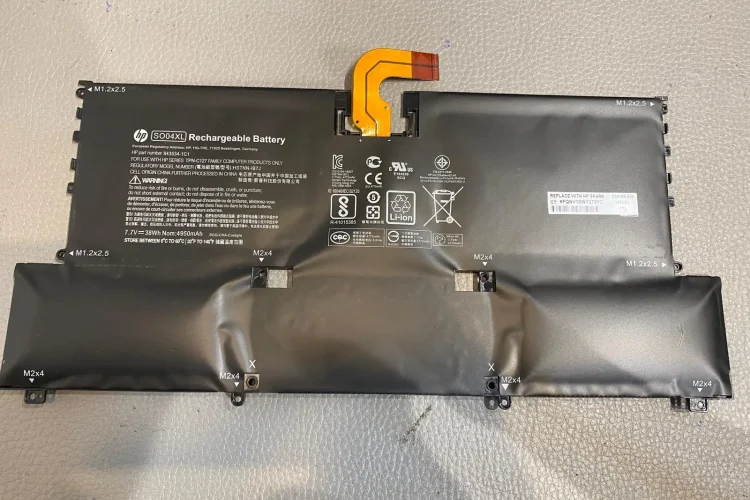 An image of a swollen battery, indicating the need for battery replacement.