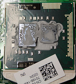 Dried, cracked thermal paste on CPU signals urgent replacement before laptop overheats